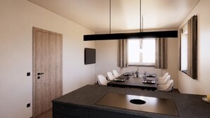 Un comedor moderno con una isla central, una puerta de madera y un ventanal con cortinas.