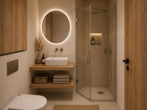 Ein modernes Badezimmer mit einem weißen Waschbecken, einem runden Spiegel, einer Duschkabine aus Glas und Holzschränken.