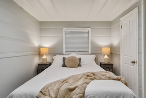 Unwind with a reading lamp on each side of the queen bed - Steps to Lake Tahoe | Fenced Yard | Modern Cabin (South Lake Tahoe)