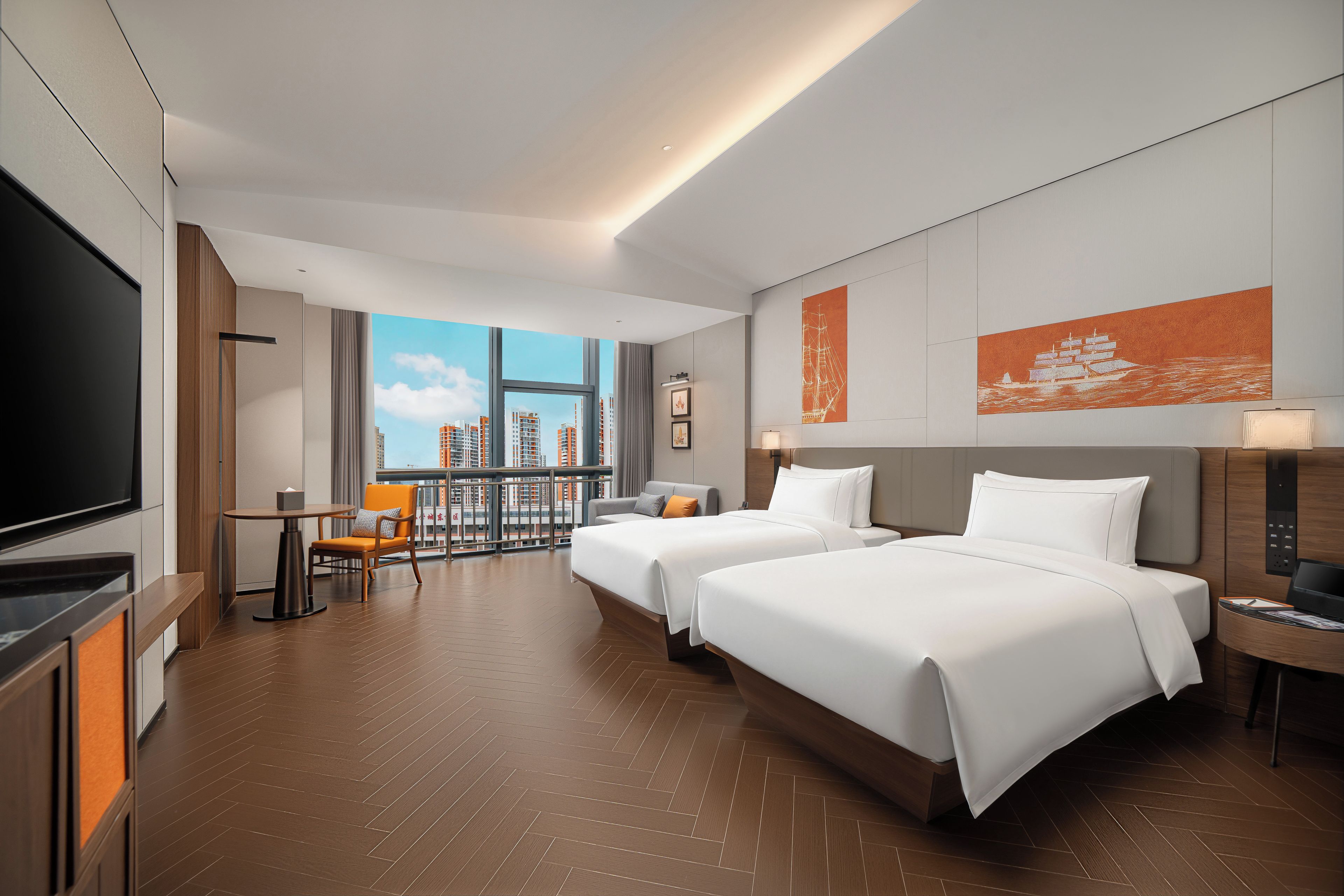A hotel room with two beds, a TV, a balcony with a city view, and a large window.
