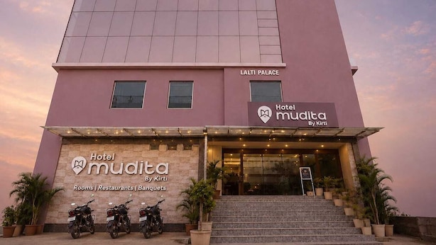A hotel building with a sign for 'Hotel Mudita By Kirti' and a 'LALTI PALACE' sign above it. - HOTEL MUDITA BY KIRTI (Patna)
