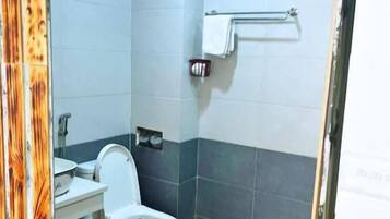 Shower, free toiletries, hair dryer, slippers
