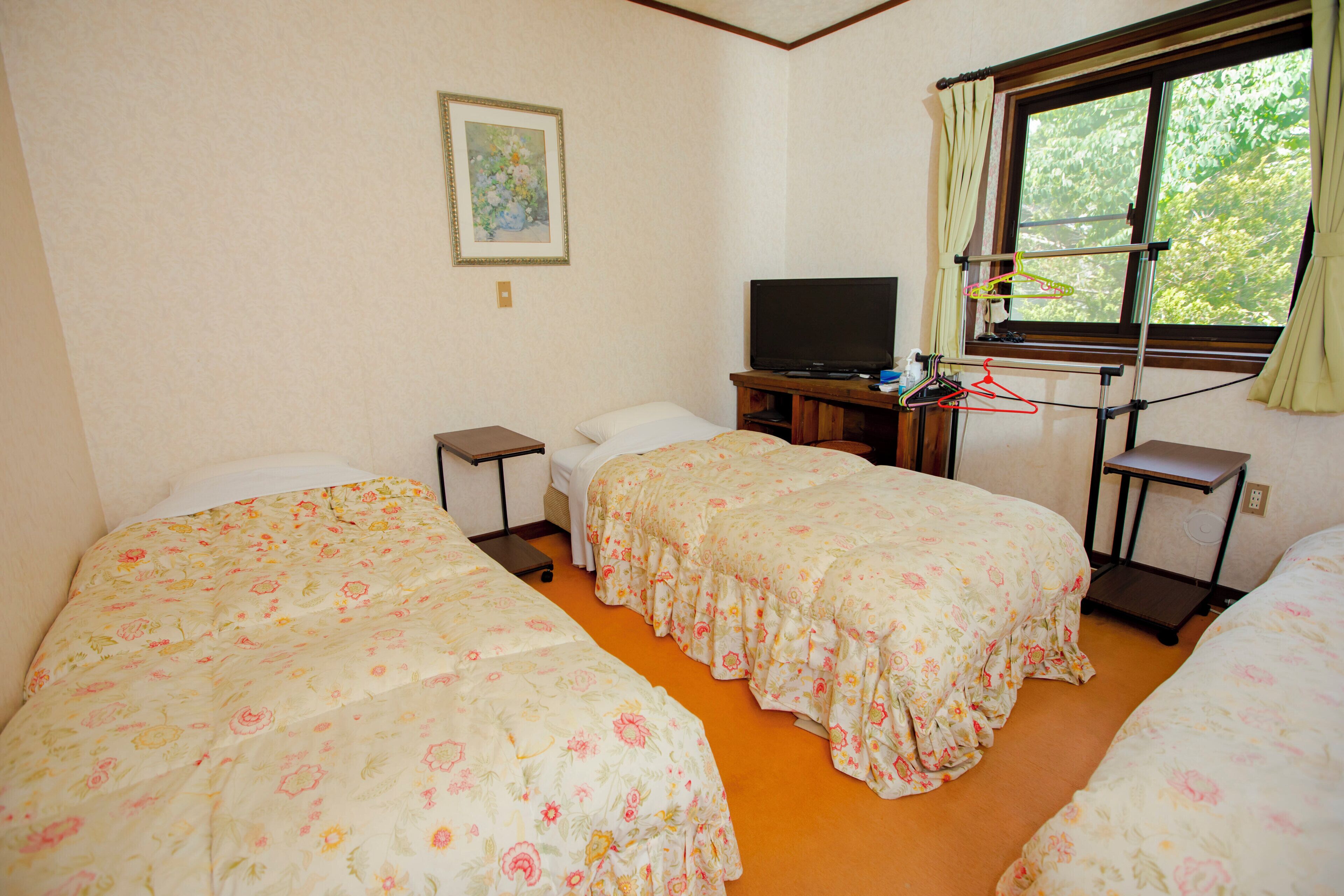 Basic Triple Room, Courtyard View | Garden view