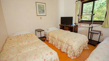 Basic Triple Room, Courtyard View | Garden view