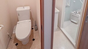 A compact bathroom with a toilet, a shower area, and a sink. - GrandPacific Ebisuhonmachi (Osaka)