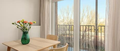 Luxury Apartment, Balcony, Courtyard View | In-room dining