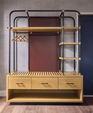 A bunk bed with a wooden base and drawers, a red mattress, and metal railings. - Canopy by Hilton Deer Valley (Park City)