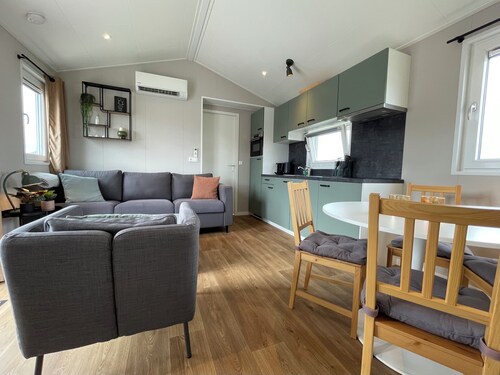 Comfortable holiday home for 4 guests with a waterfront terrace, private swimming ladder, and private mooring dock.