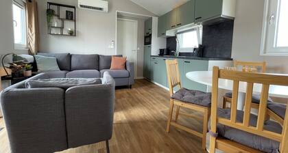 Comfortable holiday home for 4 guests with a waterfront terrace, private swimming ladder, and private mooring dock.