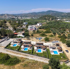 A modern resort with multiple villas, each featuring a private pool and a well-maintained garden. - Orama Sunset | Emily Villa (Rhodes)