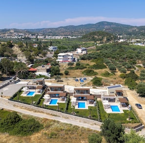 A modern resort with multiple villas, each featuring a private pool and a well-maintained garden. - Orama Sunset | Stela Villa (Rhodes)