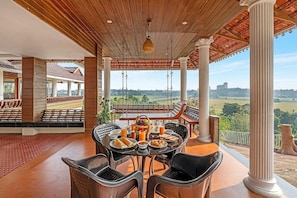 Outdoor dining - DanCenter Lakshmipuram Palace by CheckIn (Kottayam)
