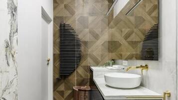 Luxury Apartment, Balcony, City View | Bathroom | Separate tub and shower, rainfall showerhead, hair dryer, towels
