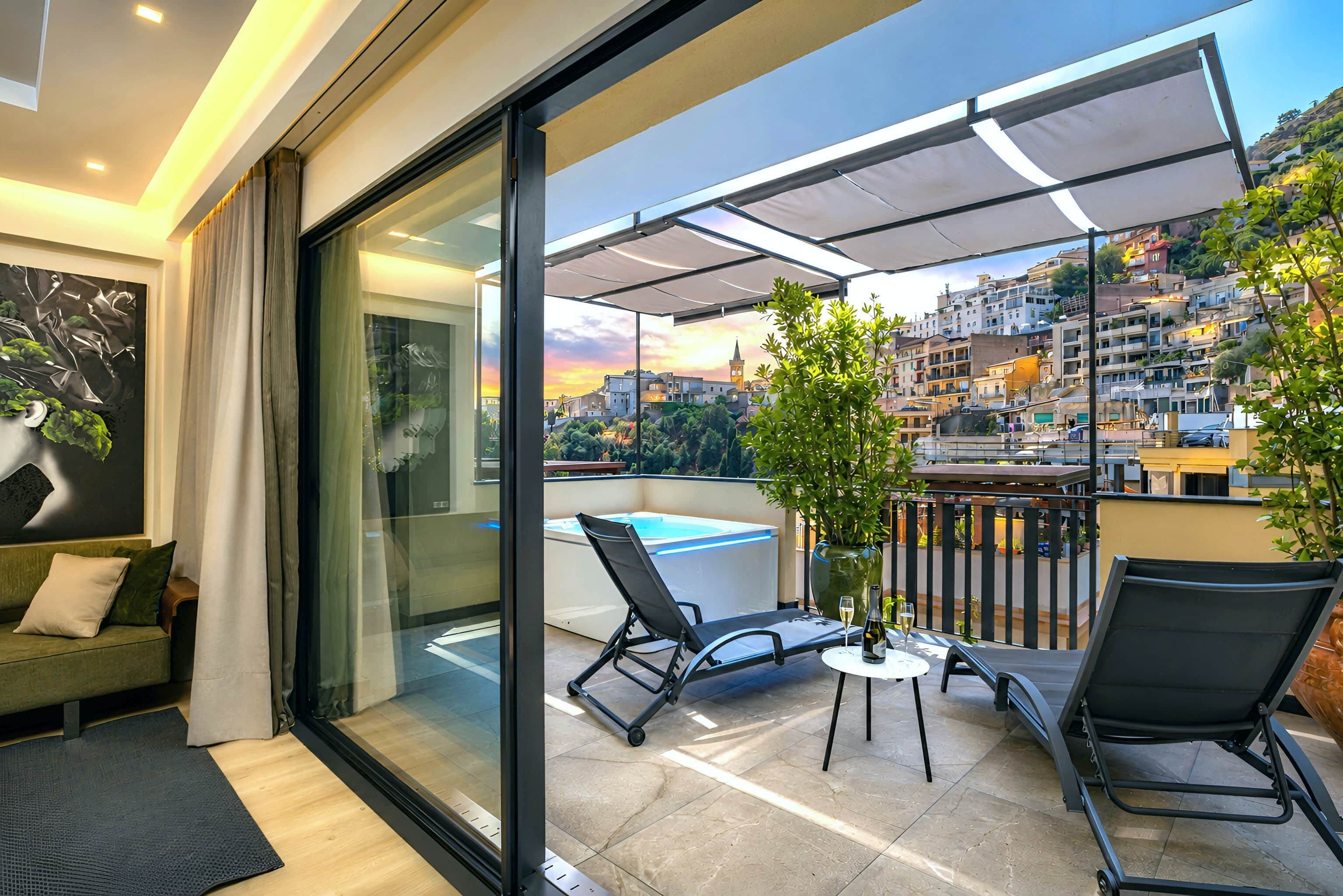 A balcony with a glass door, a pool, and a table with chairs.