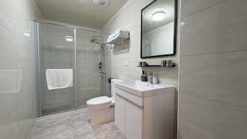 Shower, hair dryer, slippers, towels