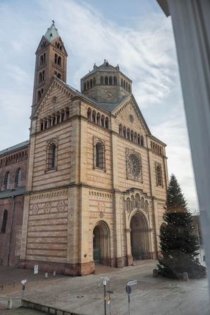 A historic building with a prominent clock tower and arched windows.