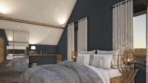 A bedroom with a sloped ceiling, a large bed, two bedside tables, and a view through a window. - Domaine Le H – A Nature Getaway with Panoramic Views of the Vosges (Hohrod)