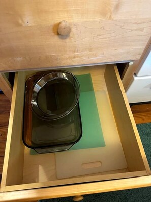 A wooden drawer with a glass container and a green mat inside. - Hidden Countryside Gem with Fire Pit & Tranquil Setting in Aspers, Pennsylvania (Aspers)