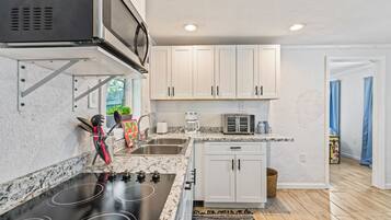 Fridge, microwave, stovetop, coffee/tea maker