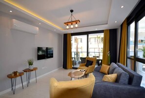 Apartemen, 1 kamar tidur, balkon | Ruang keluarga