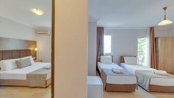 Family Twin Room, Balcony, Garden View | In-room safe, blackout drapes, soundproofing, free WiFi
