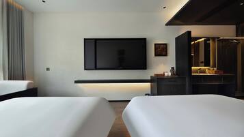 Deluxe Twin Room | Minibar, desk, laptop workspace, blackout drapes