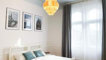 Habitación Deluxe, 3 camas individuales | Tabla de planchar con plancha y wifi gratis