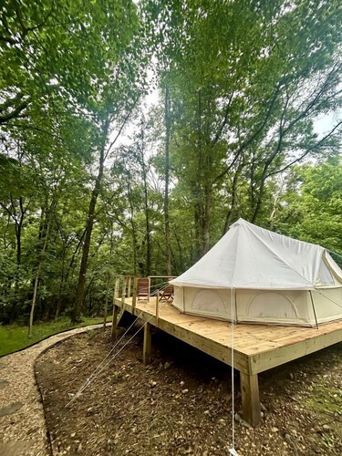 Enchanting Mountain Glamping Tents with Elevated Decks and Fire Pit Near Gentry, AR