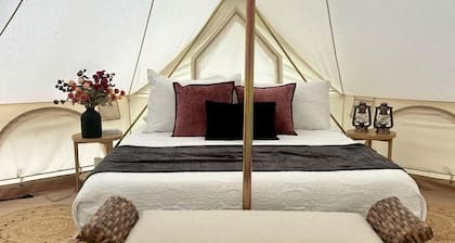 Enchanting Mountain Glamping Tents with Elevated Decks and Fire Pit Near Gentry, AR