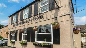 A building with a sign reading 'The Shepherds Tap & Crook.' - Walcott Lodges - Catley (Lincoln)