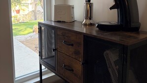 A kitchenette with a toaster, coffee maker, and a cabinet with drawers. - Peace and quiet, vacation, view of the pond, Varages Beach (Saint mitre les remparts)