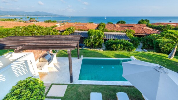 A residential property with a swimming pool, outdoor grill, and a view of the ocean. - Villa Turquesa in Punta Mita (Punta de Mita)