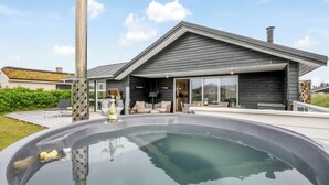 A modern house with a swimming pool, a patio, and a large window overlooking the yard. - Lovely holiday home with a wilderness bath, close to the North Sea and. (Ringkøbing)
