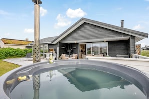 A modern house with a swimming pool, a patio, and a large window overlooking the yard. - Lovely holiday home with a wilderness bath, close to the North Sea and. (Ringkøbing)