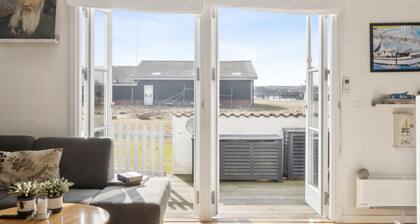 Charming holiday home with swimming pool and shared activities in Agger
