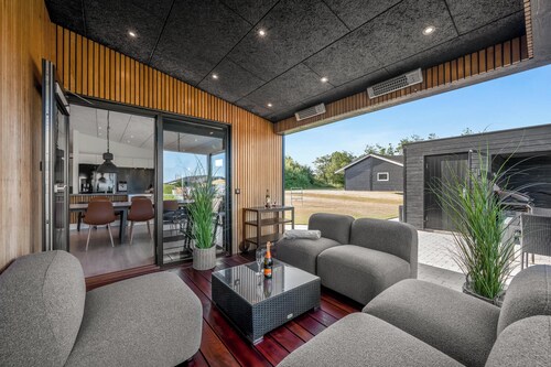 Lovely holiday home with mini golf course, sauna, wilderness bath and view of.