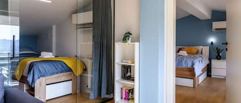 Una camera da letto moderna con un letto, un comodino e una libreria.