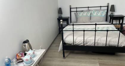 A beautiful, bright bedroom with an en suite bathroom