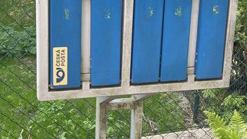 A mailbox with a label 'CESKA POSTA' and a number '9'.
