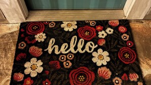 A doormat with 'hello' and floral patterns. - Farmhouse Retreat on 75 Acres with Fiber Wi-Fi, Near DeSoto (Mentone)