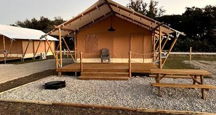 Double Deluxe Safari Tent with Fire Pit and Hammocks in Basinger, Florida
