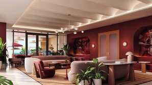 A modern interior with a seating area, a large window, and a ceiling with recessed lighting. - Heart of Brickell - Near Downtown (Miami)