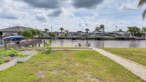 A waterfront property with a dock, grassy areas, and a view of the water. - Boat Dock Access! Pet-friendly Studio in Hudson (Hudson)