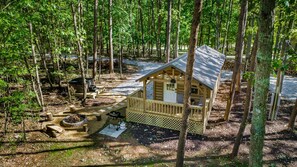A small wooden cabin with a porch, surrounded by trees. - Cozy Woodland Cabin Escape for Families, Friends & Retreats in Mentone, Alabama (Mentone)