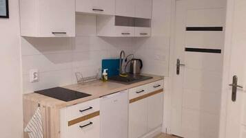 Fridge, stovetop, dining tables