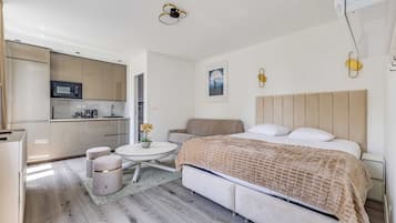 Apartment | Laptop workspace, iron/ironing board, bed sheets