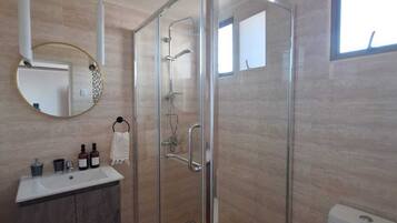 Shower, hair dryer, towels, soap