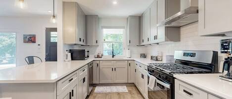 Coffee/tea maker, fridge, microwave, oven