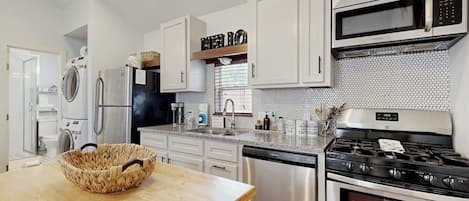 Coffee/tea maker, fridge, microwave, oven