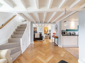 A modern interior with a staircase, a living area, and a kitchen. - Beautiful Country 3 Bed Escape, Warwickshire - Pass the Keys (Ufton)